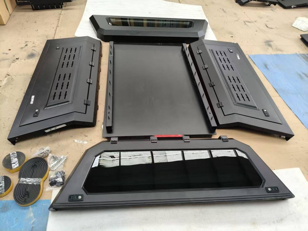Universal Truck Hardcover component kit laid out before assembly